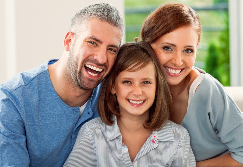 A joyful family enjoys clean smiles after dental treatment in Charles Town, WV.